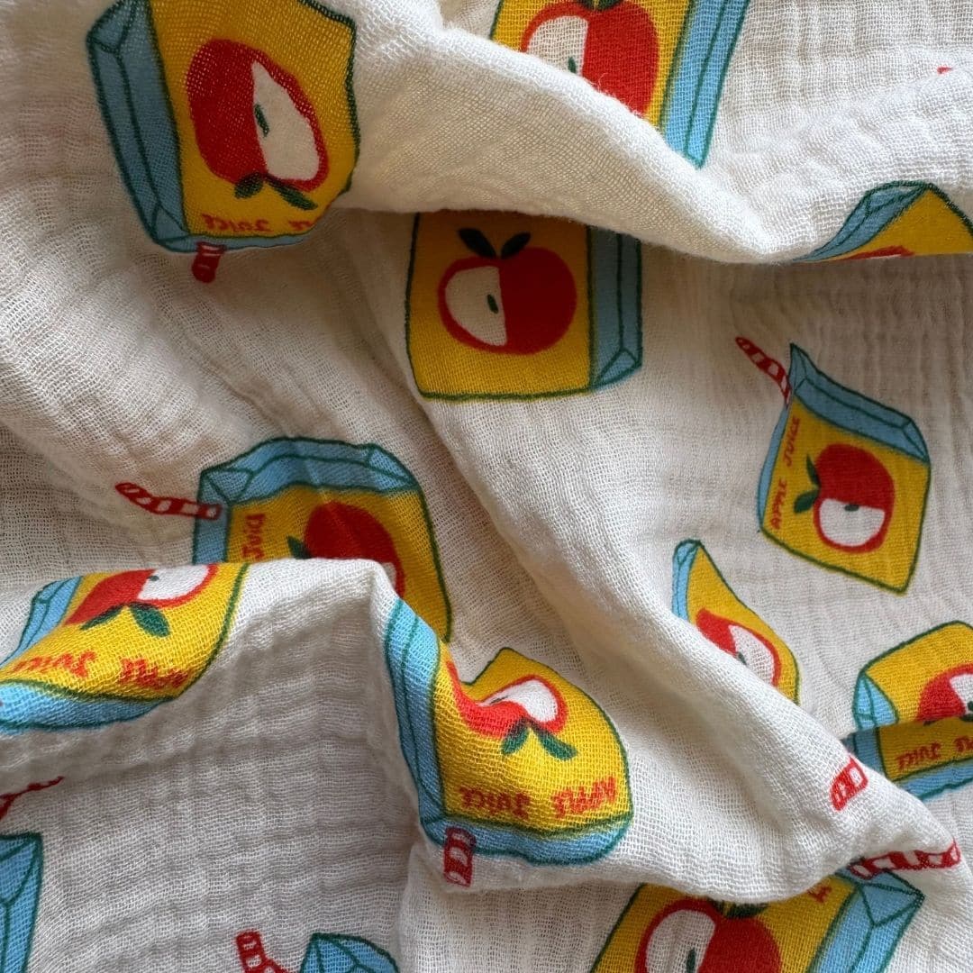Détail de la gaze de coton du lange bébé Apple Juice